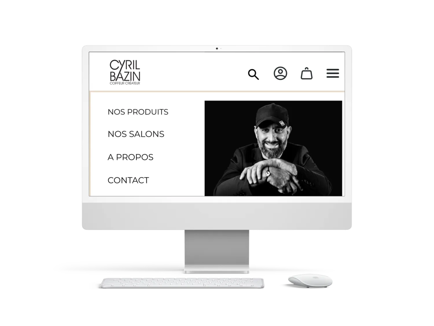 Page d'accueil sur un écran d'ordinateur : menu Nos produits, Nos salons, À propos, Contact, et portrait de Cyril Bazin